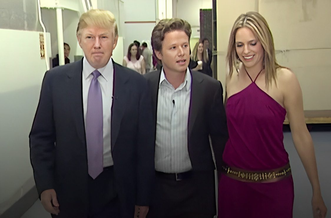 Three people standing together indoors, dressed formally.